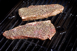 Steaks Raw on Grill