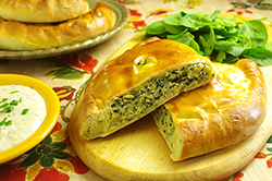 Spinach, Artichoke and Cheese Calzone with Roasted Garlic Dipping Sauce
