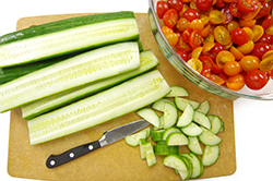 Prepping Cucumbers and Tomatoes