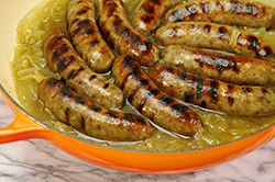 Grilled Brats in Braiser with Onions