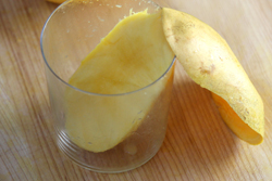 Remove mango peel with glass