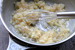 Add the flour to the butter, shallots, and garlic