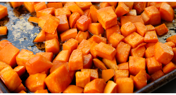 Maple Cayenne Sweet Potatoes with Cranberries and Candied Pecans